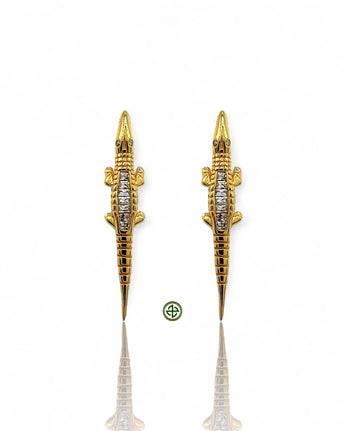 Elegant crocodile earrings crafted in 18K gold vermeil or sterling silver with sparkling baguette-cut zirconia. Unique statement jewelry perfect for layering and everyday luxury.
