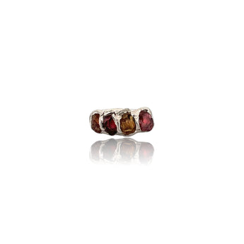 Bold. Untamed. Completely unique.
This handcrafted sterling silver statement ring features raw garnet and tourmaline gemstones in an organic electroformed setting. Each stone is left in its natural form, celebrating texture, depth and individuality.
The deep wine-red garnet contrasts beautifully with the earthy tones of tourmaline, creating a powerful yet elegant piece designed for women who love distinctive jewellery.