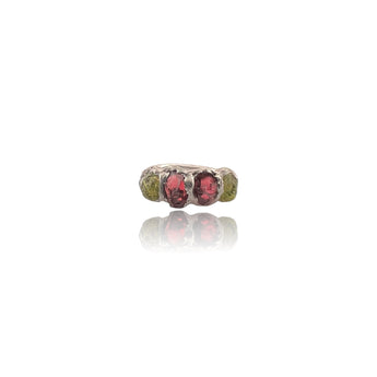 Raw Peridot & Garnet Organic Sterling Silver Ring
A bold celebration of natural colour and texture.
This handcrafted sterling silver ring features natural rough peridot and deep red garnet stones, set in an organic handmade silver setting that enhances the raw beauty of each gemstone.
The vibrant green of peridot contrasts beautifully with the rich crimson garnet, creating a striking statement piece that feels both earthy and luxurious.
Each stone is left in its natural rough form, making every ring com