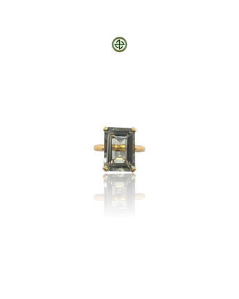 An emerald-cut green amethyst ring with a gold vermeil band on a white background.