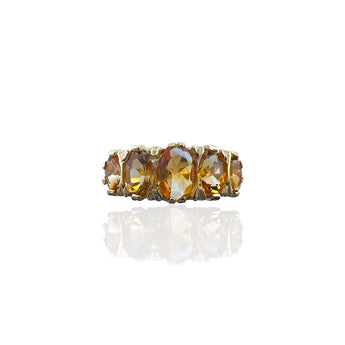 Front view of the Art Deco inspired ring with five oval golden citrines