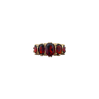 Front view of the Art Deco inspired ring with five oval deep red garnets