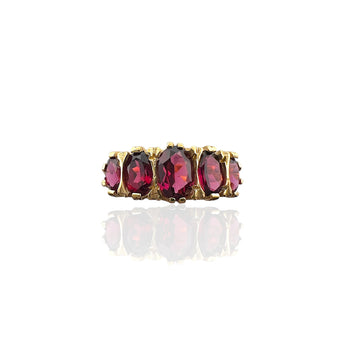 Front view of the Art Deco inspired ring with five oval raspberry rhodolite garnets