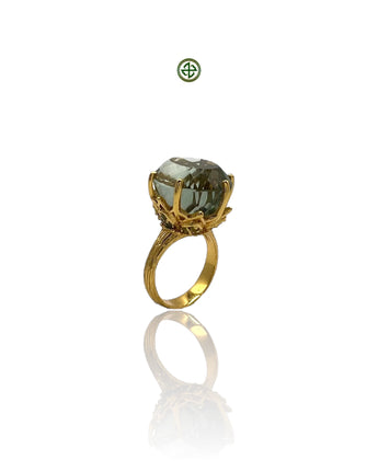 A green amethyst peridot ring with a gold vermeil band, displayed against a white background.
