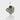 A silver ring featuring a central green onyx gemstone with gold vermeil detailing and flanked by smaller emerald stones.