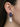 Iridescent baroque pearl drops beneath lapis lazuli pavé earring tops