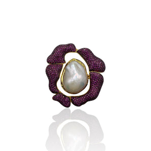 A large baroque pearl rose ring with purple zirconia accents and gold vermeil detailing.