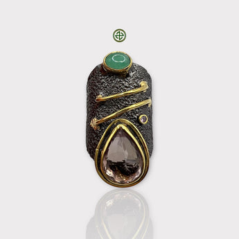 A large baroque pearl rose ring with a gold vermeil band and additional gemstone accents, displayed against a white background.