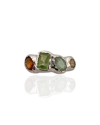 Multi gemstone statement ring in rhodium plated 925 sterling silver featuring peridot, orange tourmaline, green tourmaline and citrine. Tarnish-resistant artisan ring for everyday wear. Available in US size 6.5 (UK M) with resizing options.