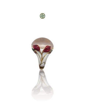 A rose quartz center stone ring with red and white enamel floral patterns and small ruby side stones, gold vermeil plating, displayed against a white background.