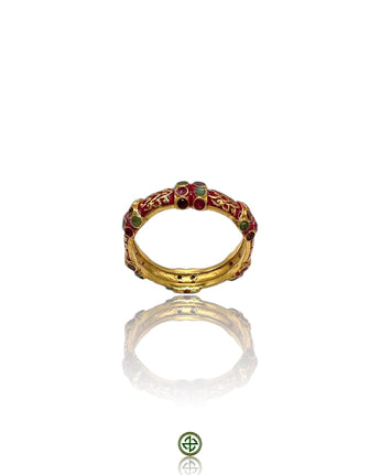 A Stucky-style eternity ring with red enamel and alternating ruby, emerald, and amethyst stones set in gold vermeil on sterling silver.