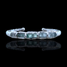 Sterling silver bracelet with rough-cut aquamarine stones. Adjustable 16–17 cm (6.3–6.7 in), hammered finish, perfect for stacking and everyday wear.
