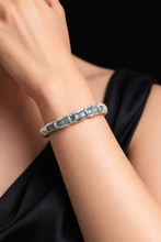 Sterling silver bracelet with rough-cut aquamarine stones. Adjustable 16–17 cm (6.3–6.7 in), hammered finish, perfect for stacking and everyday wear.
