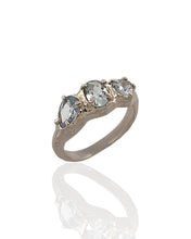 Trio aquamarine ring in rhodium plated 925 sterling silver featuring natural aquamarine gemstones. Elegant and minimal ring for everyday wear. Available in US size 6.5 (UK M) with resizing options.