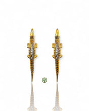 Elegant crocodile earrings crafted in 18K gold vermeil or sterling silver with sparkling baguette-cut zirconia. Unique statement jewelry perfect for layering and everyday luxury.
