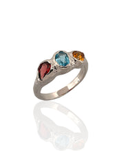 Trio gemstone ring in rhodium plated 925 sterling silver featuring Swiss blue topaz, red tourmaline and citrine. Elegant and colourful ring for everyday wear. Available in US size 7.5 (UK P) with resizing options.