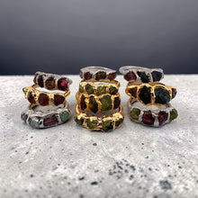 Bold. Untamed. Completely unique.

This handcrafted sterling silver statement ring features raw garnet and tourmaline gemstones in an organic electroformed setting. Each stone is left in its natural form, celebrating texture, depth and individuality.

The deep wine-red garnet contrasts beautifully with the earthy tones of tourmaline, creating a powerful yet elegant piece designed for women who love distinctive jewellery.