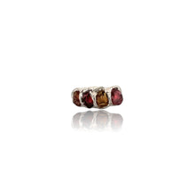 Bold. Untamed. Completely unique.

This handcrafted sterling silver statement ring features raw garnet and tourmaline gemstones in an organic electroformed setting. Each stone is left in its natural form, celebrating texture, depth and individuality.

The deep wine-red garnet contrasts beautifully with the earthy tones of tourmaline, creating a powerful yet elegant piece designed for women who love distinctive jewellery.