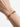 Alligator bangle worn on a wrist, showing the facing animal heads and green zirconia details across the top of the wrist.