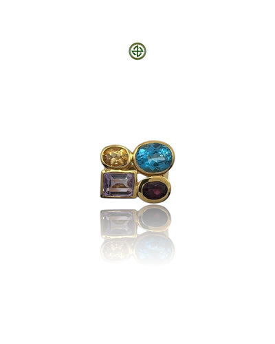 A gold vermeil ring with multiple gemstones including blue topaz, amethyst, citrine, and garnet arranged in an asymmetric design.