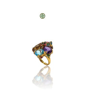 A colorful ring with blue topaz, amethyst, and citrine gemstones, set in a gold vermeil on silver band.