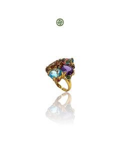 A colorful ring with blue topaz, amethyst, and citrine gemstones, set in a gold vermeil on silver band.
