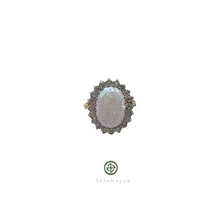 An opal and zirconia ring with a silver setting and 18ct yellow gold plating, featuring a cluster of zirconias around the opal.