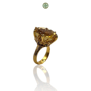 A citrine amethyst ring with 3-micron gold plating on a silver band, featuring a large citrine stone and a small amethyst at the top.