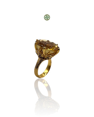 A citrine amethyst ring with 3-micron gold plating on a silver band, featuring a large citrine stone and a small amethyst at the top.