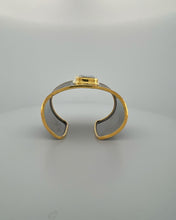 Luxury green amethyst cuff bangle crafted in black rhodium plated 925 sterling silver with thick 18K gold vermeil bezel. Elegant wide statement bracelet adjustable for 16–17 cm wrists.
