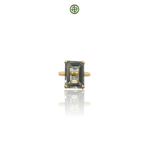 An emerald-cut green amethyst ring with a gold vermeil band on a white background.