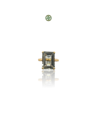 An emerald-cut green amethyst ring with a gold vermeil band on a white background.