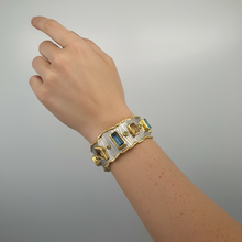 Luxury 18K gold vermeil cuff bracelet set on 925 sterling silver featuring kyanite, lemon quartz, London blue topaz, green amethyst and orange tourmaline. Handmade statement gemstone cuff.

URL Handle