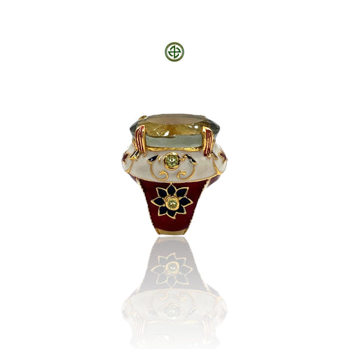 An elegant Green Amethyst Ring with gold vermeil plating, featuring a large oval green amethyst center stone, surrounded by smaller stones set in a red, white, and blue enamel design on a silver band.