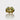 A gold-colored eternity ring with green tourmaline stones set in a silver band, viewed from the side.