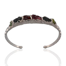 Sterling silver bracelet with rough peridot and garnet stones. Adjustable 16–17 cm (6.3–6.7 in), hammered finish, perfect for stacking and everyday wear.