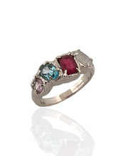 Multi gemstone statement ring in rhodium plated 925 sterling silver featuring ruby, blue topaz, moonstone and amethyst. Tarnish-resistant, handmade artisan ring for everyday wear. Available in US size 8 (UK Q) with resizing options.