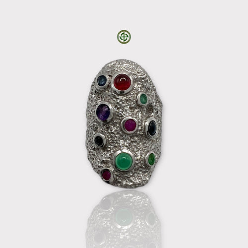 A multicolour gemstone silver ring with a textured band and round cut gemstones in various colors arranged in a pattern on the top.