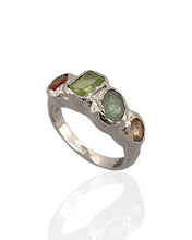 Multi gemstone statement ring in rhodium plated 925 sterling silver featuring peridot, orange tourmaline, green tourmaline and citrine. Tarnish-resistant artisan ring for everyday wear. Available in US size 6.5 (UK M) with resizing options.