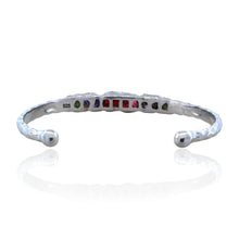 Sterling silver bracelet with rough peridot and garnet stones. Adjustable 16–17 cm (6.3–6.7 in), hammered finish, perfect for stacking and everyday wear.