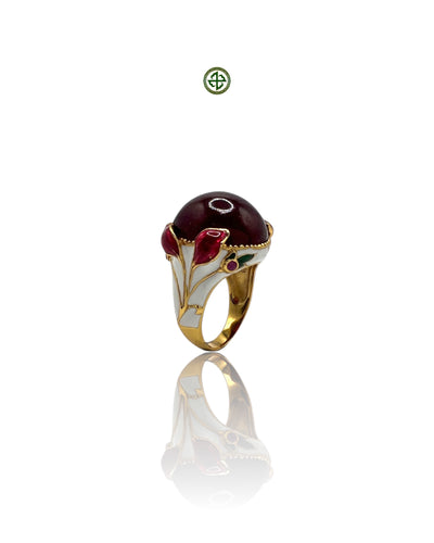 A ruby enamel statement ring with gold vermeil plating and white and red enamel details, displayed against a white background.
