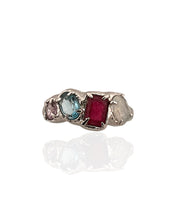 Multi gemstone statement ring in rhodium plated 925 sterling silver featuring ruby, blue topaz, moonstone and amethyst. Tarnish-resistant, handmade artisan ring for everyday wear. Available in US size 8 (UK Q) with resizing options.