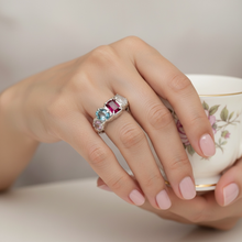 Multi gemstone statement ring in rhodium plated 925 sterling silver featuring ruby, blue topaz, moonstone and amethyst. Tarnish-resistant, handmade artisan ring for everyday wear. Available in US size 8 (UK Q) with resizing options.