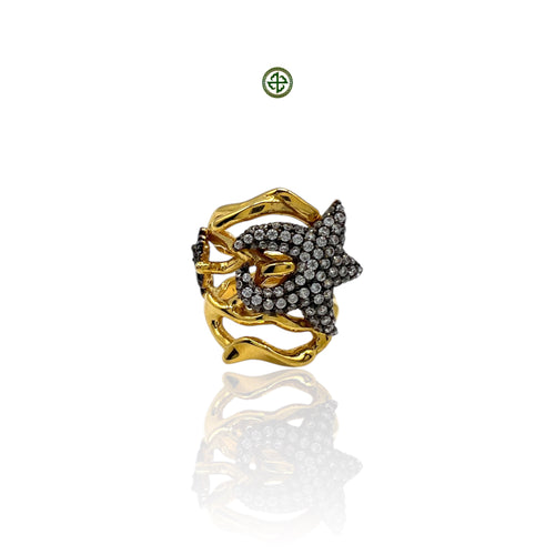 A gold vermeil ring with a starfish shape adorned with white zirconia stones.