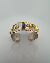 Luxury 18K gold vermeil cuff bracelet set on 925 sterling silver featuring kyanite, lemon quartz, London blue topaz, green amethyst and orange tourmaline. Handmade statement gemstone cuff.