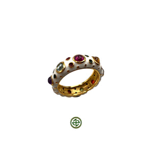 A silver ring with multiple colorful gemstones set in a Barrel ring design with a textured pale white enamel band.
