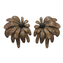 A pair of floral-shaped earrings with gold and black plating and zirconia stones