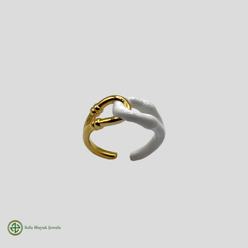 A two-tone gold and white enamel ring with a minimalist design