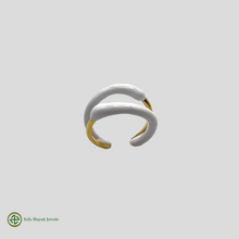 A two-tone gold and white enamel ring without stones, displayed against a white background.