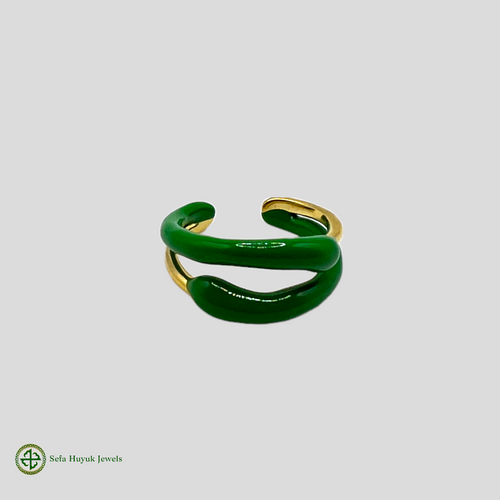 A two-tone gold and green enamel ring without stones, displayed against a white background.